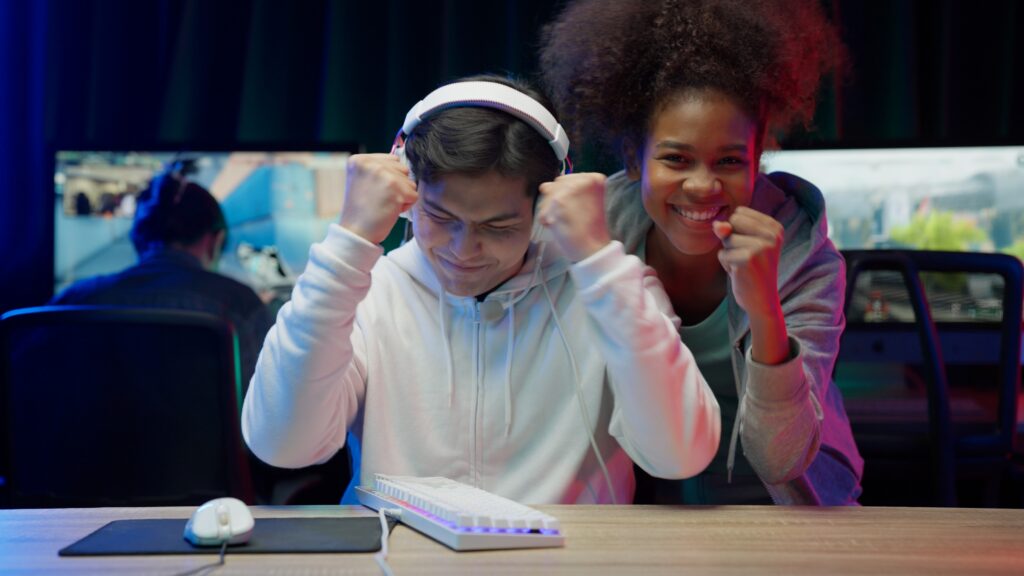 excited-gamers-celebrating-victory-at-computer-des-2026-03-09-08-13-09-utc