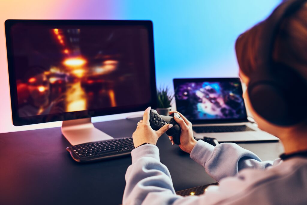 young-gamer-plays-console-with-headphones-on-desk-2026-03-24-07-09-06-utc